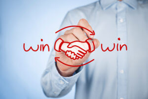 Win-win partnership strategy concept. Businessman draw win-win scheme and handshake partnership agreement.